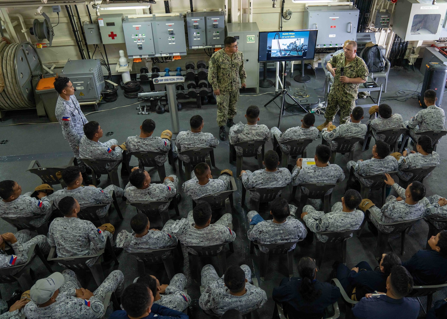 241008-N-DM318-1013 SUBIC, PHILIPPINES (October 8, 2024) U.S. Navy Senior Chief Boatswain's Mate Andrew Werner, from Lafayette, Indiana, attached to Military Sealift Command (MSC) Far East, right, and Chief Boatswain's Mate Francisco Fuentes, from East Rutherford, New Jersey, attached to Commander, Destroyer Squadron (DESRON) 7, provide instruction on a refueling-at-sea aboard the Philippine Navy frigate BRP Jose Rizal (FF 150) as part of Sama Sama 2024, at Philippine Naval Operating Base, Subic, Zambales, Oct. 8, 2024. Sama Sama is a bilateral exercise hosted by the Philippines and United States, with participants from Australia, Canada, France, and Japan, designed to promote regional security cooperation, maintain and strengthen maritime partnerships, and enhance maritime interoperability. (U.S. Navy photo by Mass Communication Specialist 2nd Class Ange Olivier Clement)