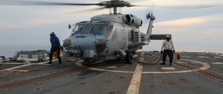 U.S. Navy Boatswain’s Mate Seaman Ronnie Gonzalez, from West Covina, California, left, and Boatswain's Mate 2nd Class Diquan Anderson, from Cameron, North Carolina, conduct flight quarters aboard the Arleigh Burke-class guided-missile destroyer USS Howard (DDG 83) in preparation for a maneuvering exercise in the South China Sea as part of Sama Sama 2024, Oct. 16, 2024.