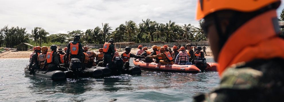 U.S. Marines attached to Marine Rotational Force-Southeast Asia, Philippine Marines with 4th Marine Brigade, members of the Philippine Bureau of Fire Protection, and service members of the Japanese Ground Self-Defense Force, conduct small boat practical application during KAMANDAG 8 at Camp Cape Bojeador, Burgos, Philippines, Oct. 16, 2024.