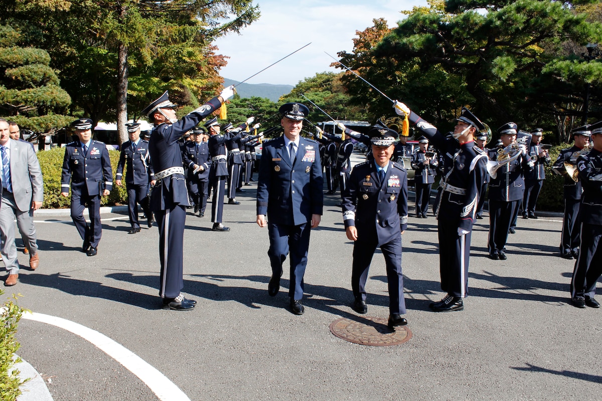 Chief of Staff of the Air Force Gen. David Allvin is welcomed by Gen. Lee Young-su, Republic of Korea Air Force Chief of Staff, as they walk through a saber arch in Gyeryongdae, South Korea, Oct. 17, 2024.