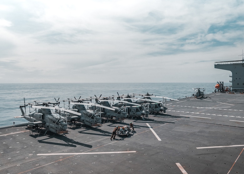 U.S. Marine Corps AH-1Z Vipers and UH-1Y Venoms attached to Marine Medium Tiltrotor Squadron (VMM) 165 (Reinforced), 15th Marine Expeditionary Unit, rest on the flight deck of the expeditionary sea base Miguel Keith (ESB 5) while underway in the Philippine Sea, Sept. 26, 2024.