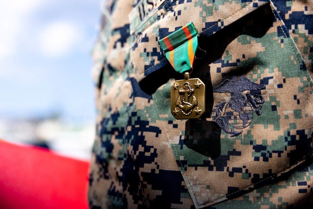 U.S. Marines and Sailors are awarded with Navy and Marine Corps Achievement Medals and Letters of Appreciation at Camp Schwab, Okinawa, Japan, Oct. 11, 2024. The Marines and Sailors were awarded for their heroic actions in providing aid to a Japanese local after a vehicle accident in Okinawa, Japan. The Marines are with 4th Marine Regiment, 3d Marine Division. (U.S. Marine Corps photo by Cpl. Michael Taggart)