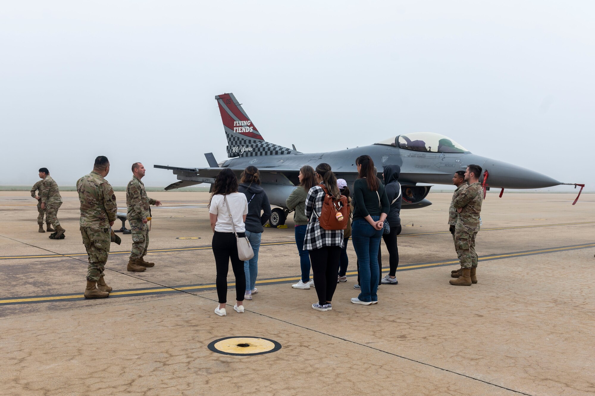 U.S. Air Force members assigned to 51st Fighter Wing brief Osan spouses about their careers and the F-16 Fighting Falcon during an Osan Spouse Immersion Tour at Osan Air Base, Republic of Korea, Oct. 16, 2024. The Osan Spouse Immersion Tour gives spouses and partners the opportunity to see what 51st FW Airmen do in their jobs and showcases how they directly contribute to the mission. (U.S. Air Force photo by Senior Airman Kaitlin Frazier)