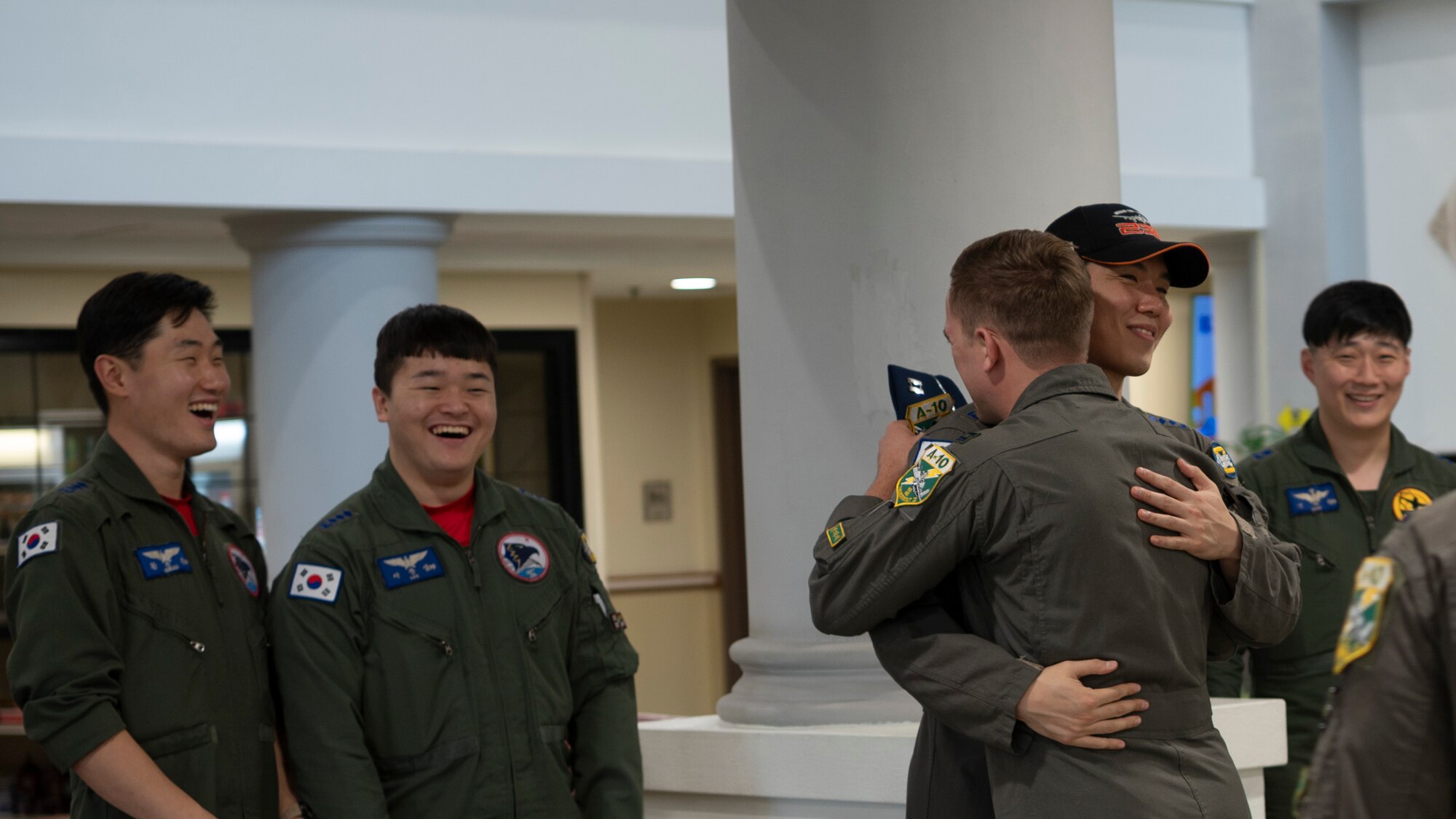 Republic of Korea Air Force pilots assigned to the 8th Fighter Wing out of Wonju Air Base, greet members of the 25th Fighter Squadron at Osan Air Base, ROK, Oct. 15, 2024. The Buddy Squadron program is a tradition unique to the ROK dating back to the late 1990s where pilots from the U.S. and Korea join forces to collaborate on training and exchange knowledge. (U.S. Air Force photo by Staff Sgt. Ashley N. Mikaio)