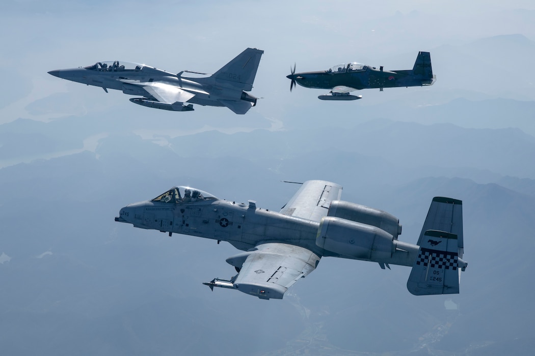 A Republic of Korea Air Force FA-50 Golden Eagle, right, and KA-1 Woongbi, left, assigned to the ROKAF 8th Fighter Wing train with an A-10 Thunderbolt II, center, assigned to the 25th Fighter Squadron during a Buddy Squadron 25-1 flight over Osan Air Base, ROK, Oct. 16, 2024. The purpose of the semi-annual event is to integrate U.S. Air Force and ROKAF units so that they can seamlessly collaborate if ever needed to defend the peninsula and “Fight Tonight.” (Courtesy Photo)