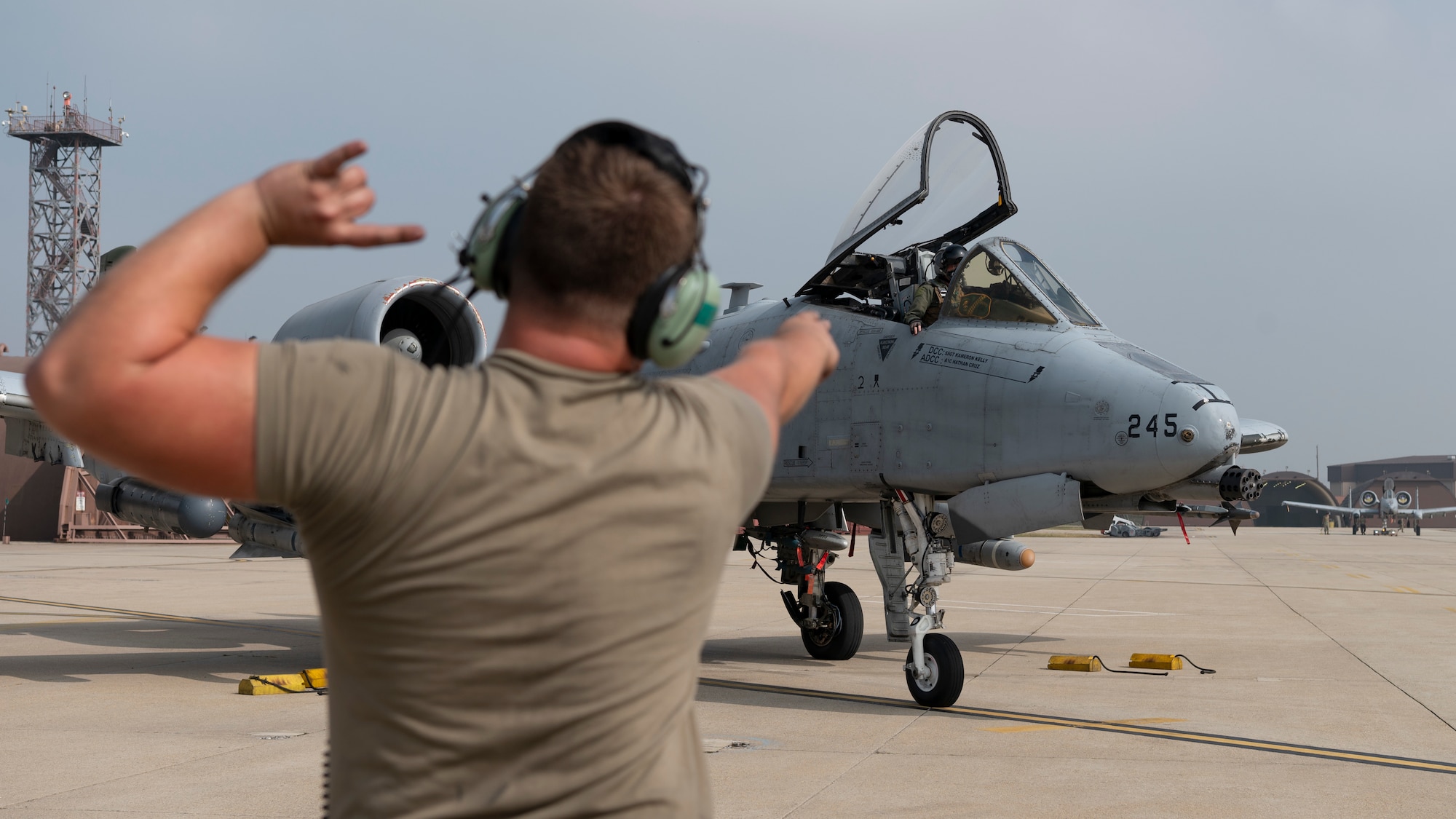 U.S. Air Force Senior Airman Matthew Cover, left, 25th Fighter Generation Squadron crew chief marshals U.S. Air Force Lt. Col. Matthew Cichowski, 51st Operations Group deputy commander, in an A-10 Thunderbolt II before a Buddy Squadron 25-1 flight at Osan Air Base, Republic of Korea, Oct. 16, 2024. Buddy Squadron is a tradition unique to the ROK dating back to the late 1990s where pilots from the U.S. and Korea join forces to collaborate on training and exchange knowledge. (U.S. Air Force photo by Staff Sgt. Ashley N. Mikaio)