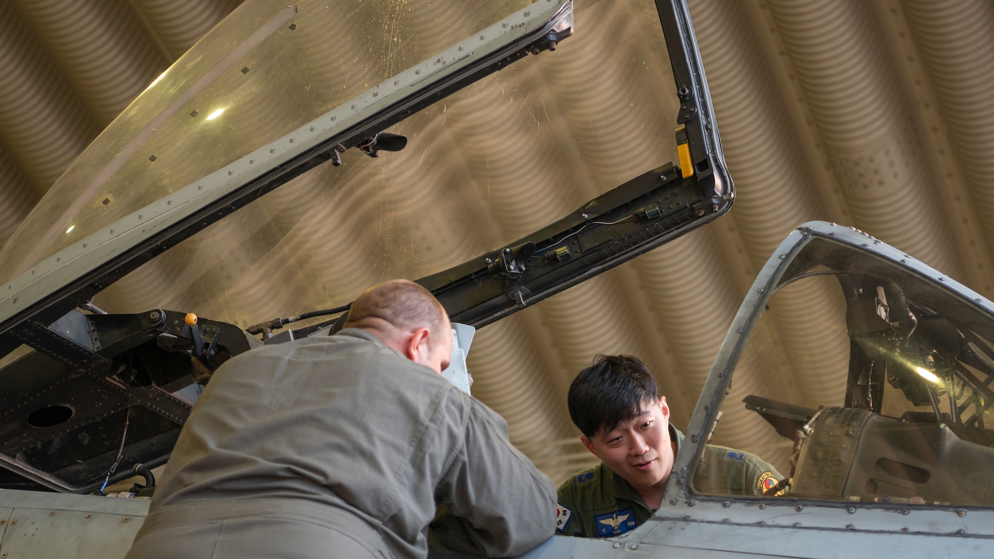 A Republic of Korea Air Force pilot looks into the cockpit of an A-10 Thunderbolt II while a U.S. Air Force pilot assigned to the 25th Fighter Squadron explains some of the functions at Osan Air Base, ROK, Oct. 16, 2024. Members gathered for Buddy Squadron 25-1 intended to integrate U.S. Air Force and ROKAF units so that they can seamlessly collaborate if ever needed to defend the peninsula and “Fight Tonight.” (U.S. Air Force photo by Staff Sgt. Ashley N. Mikaio)