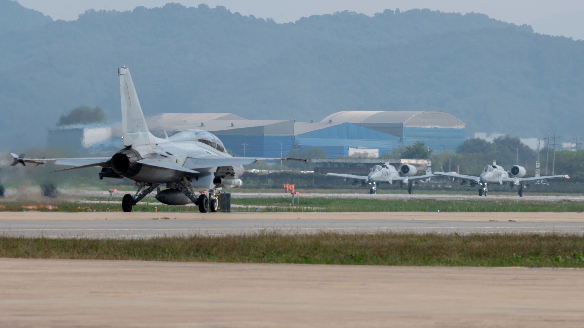 A Republic of Korea Air Force FA-50 Golden Eagle assigned to the ROKAF 8th Fighter Wing, and two A-10 Thunderbolt II’s assigned to the 25th Fighter Squadron prepare for take-off during their semi-annual Buddy Squadron event at Osan Air Base, ROK, Oct. 17, 2024. The 25th FS hosted the event intended to integrate U.S. Air Force and ROKAF units so that they can seamlessly collaborate if ever needed to defend the peninsula and “Fight Tonight.” (U.S. Air Force photo by Staff Sgt. Ashley N. Mikaio)