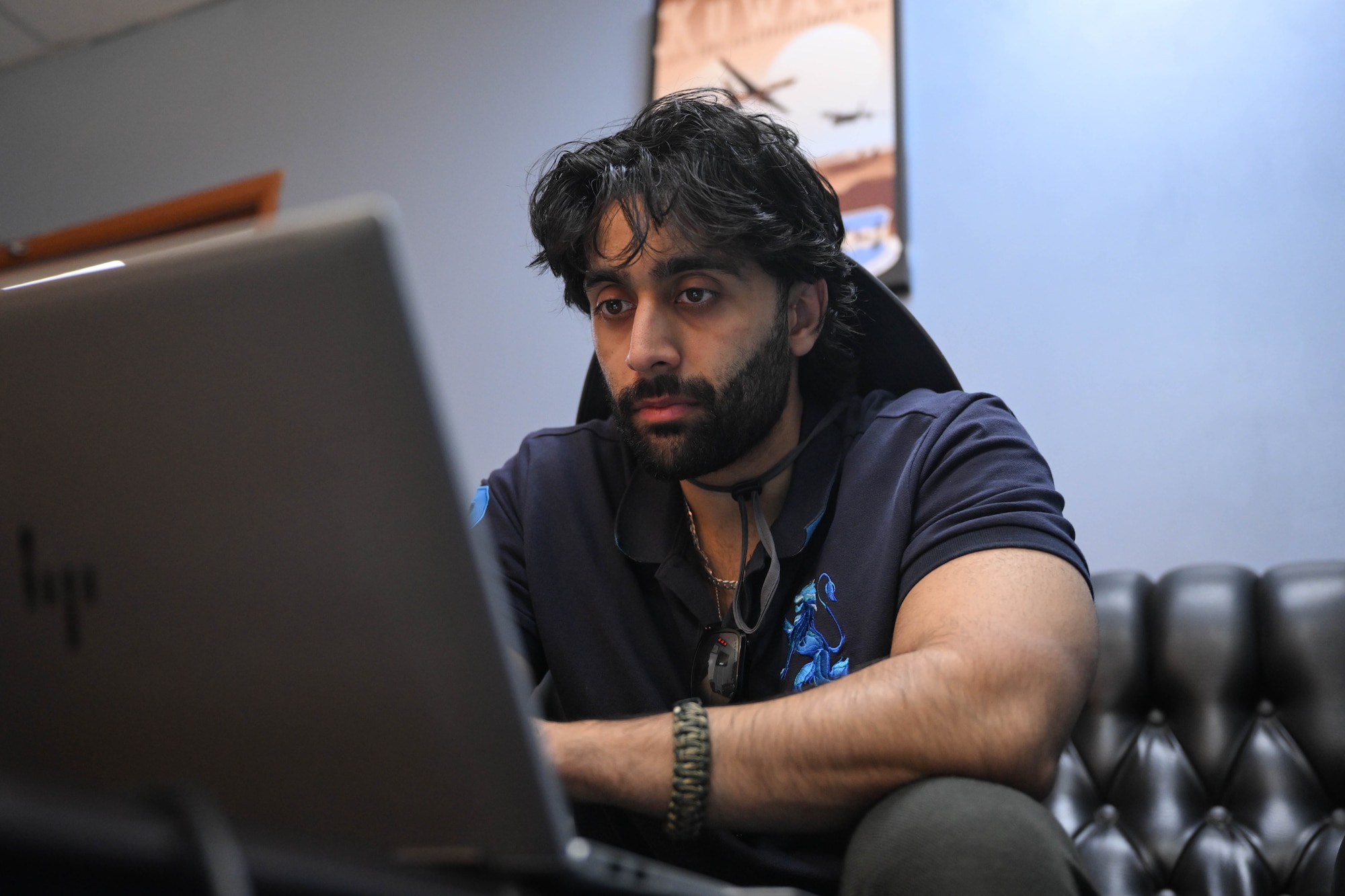A man works on a computer.