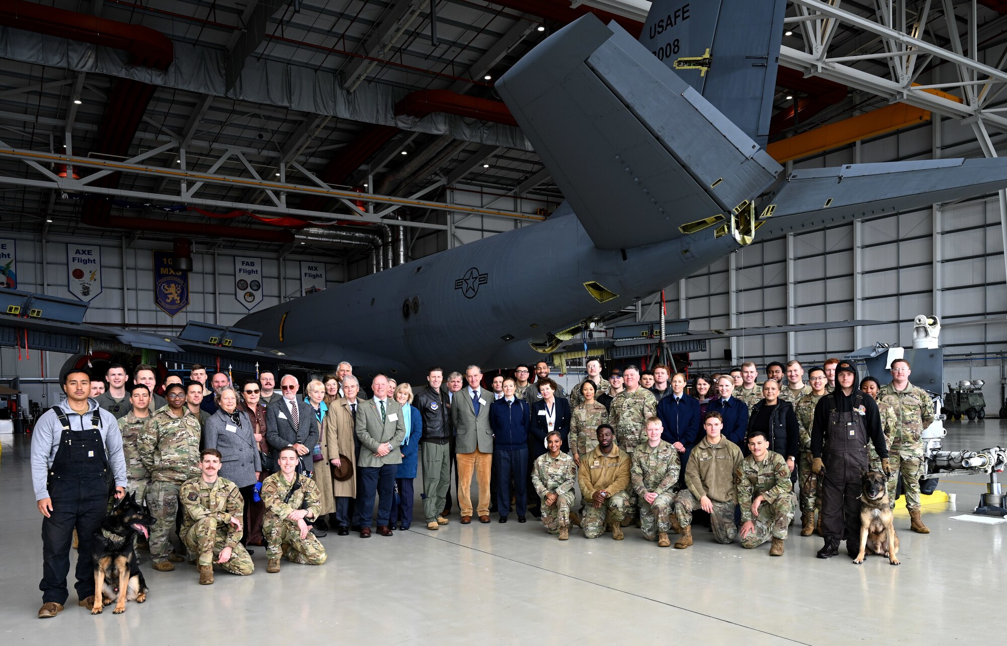 Members from Team Mildenhall, Vice Lord-Lieutenants, Deputy Lieutenants, High Sheriffs, Royal Air Force representatives and other invited guests from the local community gather in front of a KC-135 Stratotanker from the 100th Air Refueling Wing at Royal Air Force Mildenhall, England, Oct. 9, 2024. The event aimed to facilitate interactions between new appointees and base leadership, providing insights into the wing’s missions and showcasing various aircraft. (U.S. Air Force photo by Karen Abeyasekere)