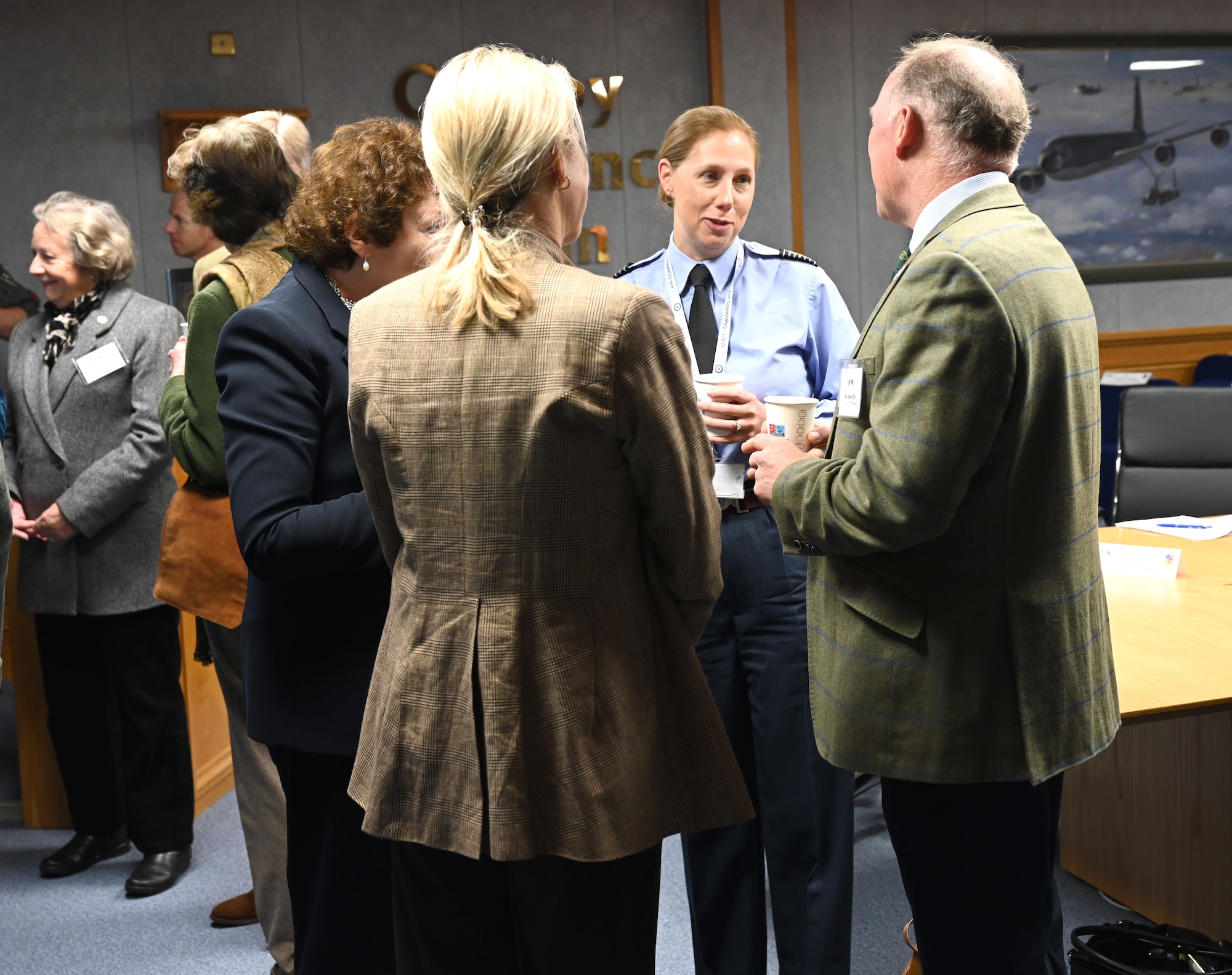 Royal Air Force Group Capt. Leonie Boyd, second right, RAF Marham Station Commander and U.S. Visiting Forces Support Group commander, talks with High Sheriffs from Suffolk and Norfolk before the start of a special event for Vice Lord-Lieutenants, Deputy Lieutenants, High Sheriffs, Royal Air Force representatives and other invited guests from the local community at Royal Air Force Mildenhall, England, Oct. 9, 2024. The event aimed to facilitate interactions between new appointees and base leadership, providing insights into the wing’s missions and showcasing various aircraft. (U.S. Air Force photo by Karen Abeyasekere)