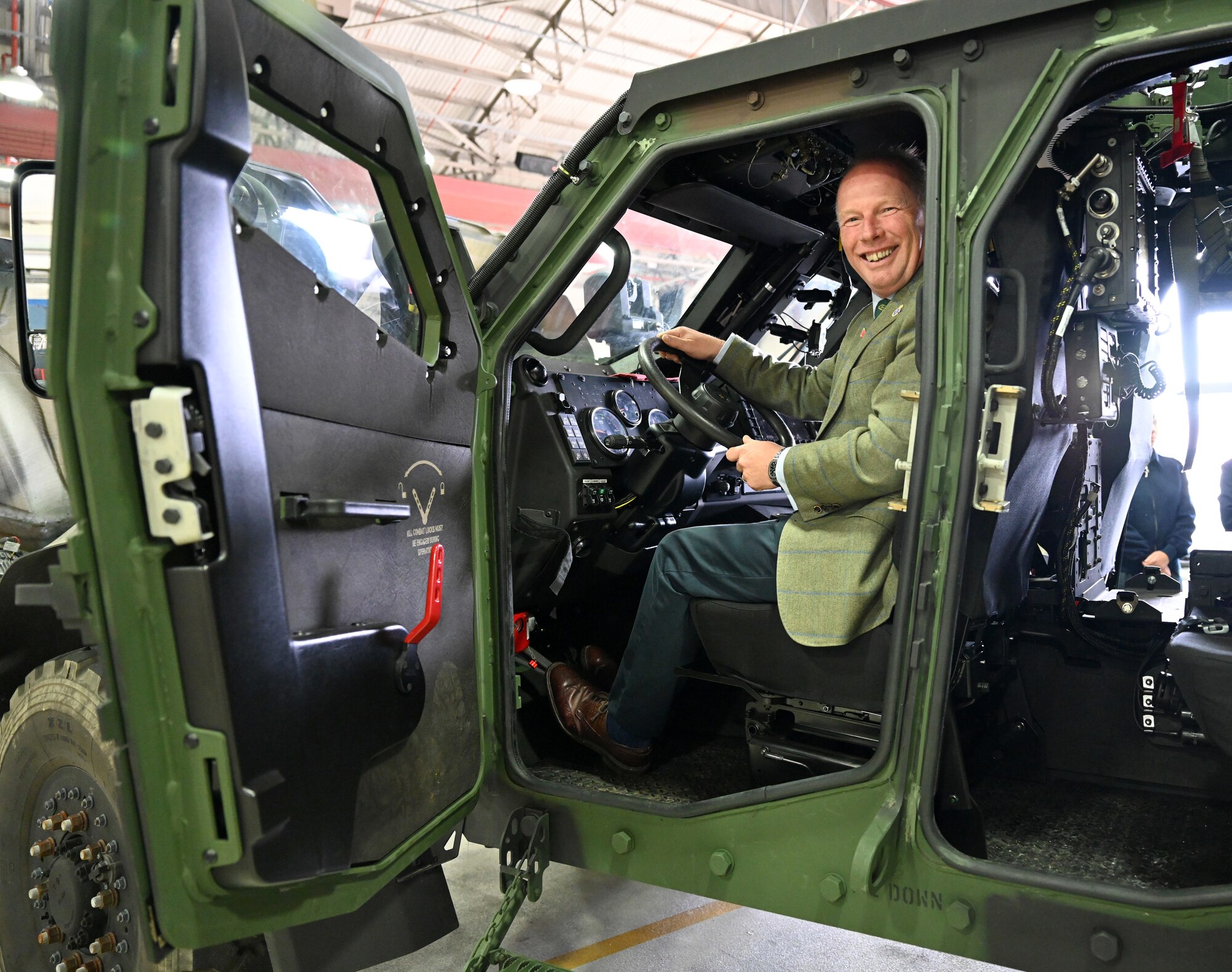 David Flux, High Sheriff of Norfolk, takes a close up look at a Joint Light Tactical Vehicle as part of the 48th Security Forces Squadron display during a special event for Vice Lord-Lieutenants, Deputy Lieutenants, High Sheriffs, Royal Air Force representatives and other invited guests from the local community at RAF Lakenheath, England, Oct. 9, 2024. The event aimed to facilitate interactions between new appointees and base leadership, providing insights into the wing’s missions and showcasing various aircraft. (U.S. Air Force photo by Karen Abeyasekere)