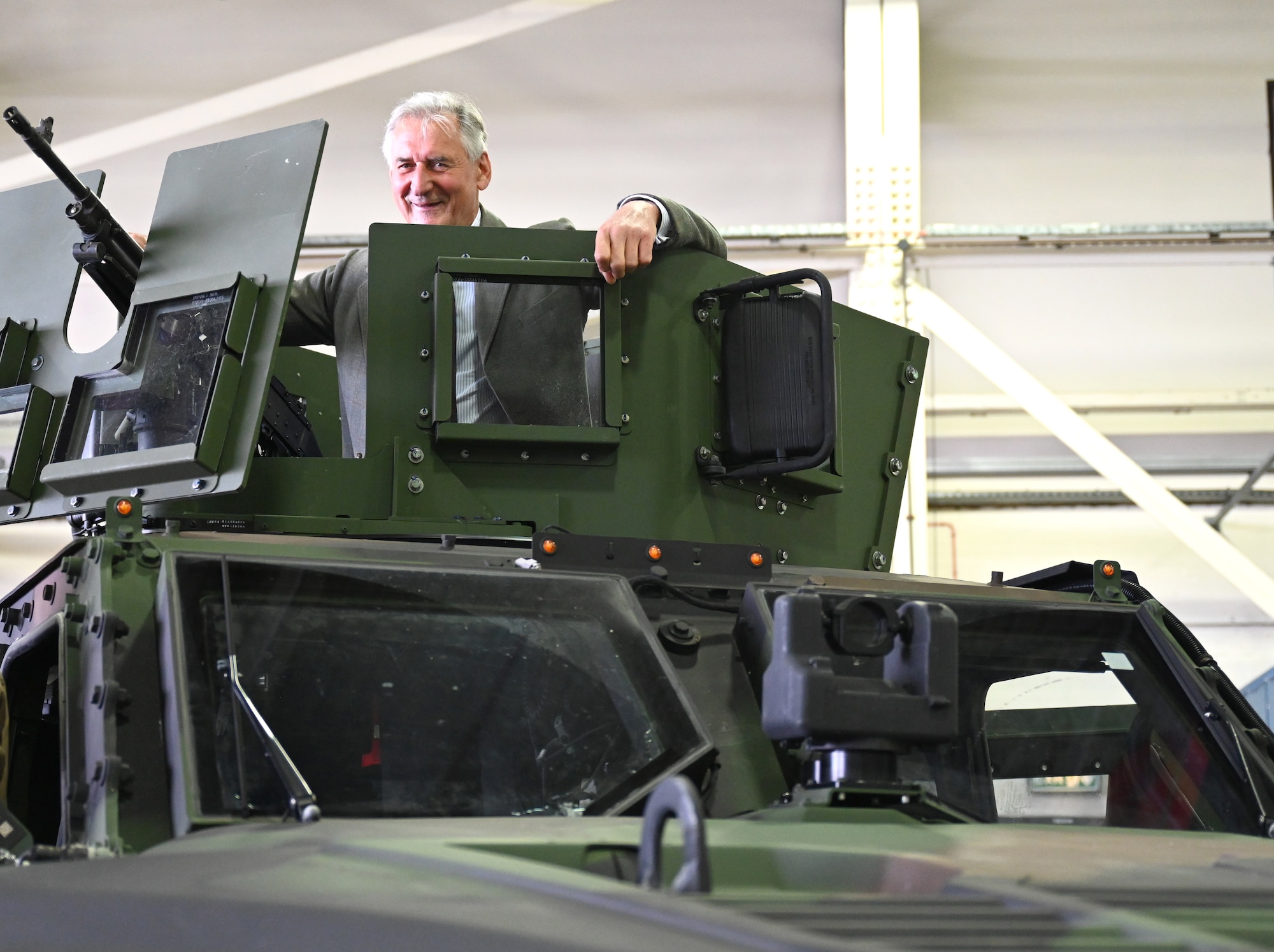 Falconer Wallace, spouse of Laura Margaret Wallace, Deputy Lieutenant of Suffolk, takes a close up look at a Joint Light Tactical Vehicle as part of the 48th Security Forces Squadron display during a special event for Vice Lord-Lieutenants, Deputy Lieutenants, High Sheriffs, Royal Air Force representatives and other invited guests from the local community at RAF Lakenheath, England, Oct. 9, 2024. The event aimed to facilitate interactions between new appointees and base leadership, providing insights into the wing’s missions and showcasing various aircraft. (U.S. Air Force photo by Karen Abeyasekere)