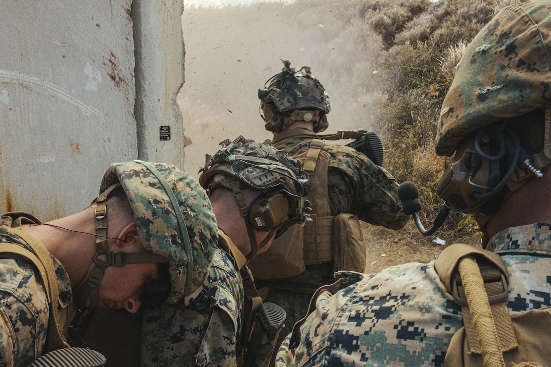 U.S. Marines with 3d Littoral Combat Team, 3d Marine Littoral Regiment, 3d Marine Division, prepare to clear a room during a demolitions range on Marine Corps Base Hawaii, Oct. 9, 2024. The drills focused on refining explosive entry techniques to ensure the Marines are prepared to strike with precision and overwhelming force at a moment's notice. (U.S. Marine Corps photo by Cpl. Jonathan Beauchamp)