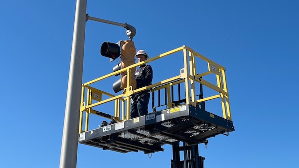 Equipment Mechanic Patrick Morrow works on traffic lights Oct. 17, 2024, at Fort Loudoun Lock on the Tennessee River in Lenoir City, Tennessee. The lights let vessel operators know when to enter and exit the navigation lock. The U.S. Army Corps of Engineers Nashville District has named Morrow as the employee of the month for July 2024. (USACE Photo by Matt Emmons)