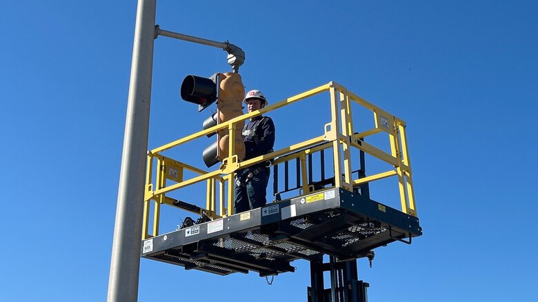 Equipment Mechanic Patrick Morrow works on traffic lights Oct. 17, 2024, at Fort Loudoun Lock on the Tennessee River in Lenoir City, Tennessee. The lights let vessel operators know when to enter and exit the navigation lock. The U.S. Army Corps of Engineers Nashville District has named Morrow as the employee of the month for July 2024. (USACE Photo by Matt Emmons)