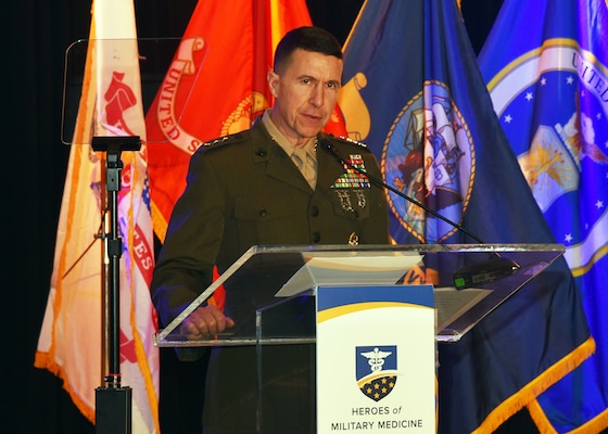 SAN ANTONIO – (Oct. 17, 2024) – U.S. Marine Corps Lt. Gen. Benjamin Watson, commanding general, Training and Education Command (TECOM), introduces Cpl. Travis Reyes as a Hero of Military Medicine Ambassador honoree during the 2024 Heroes of Military Medicine San Antonio Awards Program held at The Red Berry Estate. The awards program, hosted by the Henry M. Jackson Foundation for the Advancement of Military Medicine, Inc. (HJF), recognized exception community leaders who advance military medicine in and around the greater San Antonio area. The event brought the story of Military City USA’s unique military and civilian medical research and clinical care collaborations to national and global attention. Reyes, of Oxon Hill, Md., was an observer/aerial gunner on a MV-22 Osprey training flight that crashed on the Tiwi Islands off the coast of Darwin, Australia on Aug. 27, 2023. Requiring immediate intensive care, he was treated at Royal Darwin Hospital and subsequently transferred to the Alfred Hospital in Melbourne, Australia, where he spent approximately two months in the Intensive Care Unit. In a groundbreaking effort, the Department of Defense’s only Extracorporeal Membrane Oxygenation (ECMO) team collaborated with the U.S. Army Institute of Surgical Research (USAISR) Burn Center to orchestrate a complex retrieval mission to bring Reyes to BAMC once he was in better conditions. This mission was the longest ECMO retrieval in history and marked the first ECMO unit circuit change performed in a moving aircraft. Watson’s son was a survivor of the MV-22 Osprey crash. (U.S. Navy photo by Burrell Parmer, NAMRU San Antonio Public Affairs/Released)