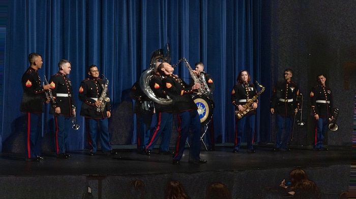 U.S. Marine Corps Staff Sgt. Lucy Warmbrodt, a Musician Technical Assistant with 9th Marine Corps District performs with the Marine Forces Reserve (MARFORRES) Brass Ensemble, at Appleton West High School in Appleton, Wisc., Oct. 7, 2024. The MARFORRES Band toured Recruiting Station Milwaukee’s area of responsibility performing for students and speaking about the benefits of the Musician Enlistment Option Program. (U.S. Marine Corps photo by Cpl. Collette Hagen)