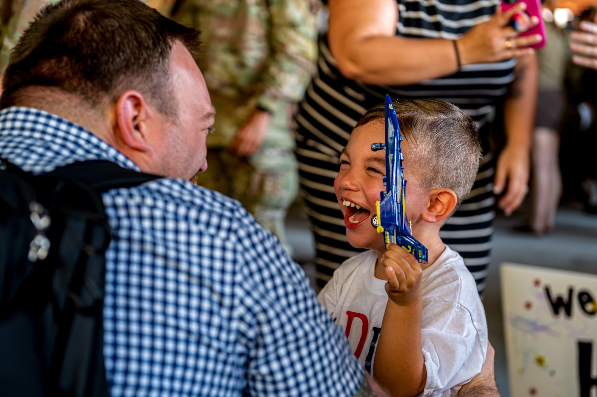 U.S. Air Force Maj. Caleb Overfelt, 15th Special Operations Squadron flight surgeon, embraces his son after returning from a deployment at Hurlburt Field, Florida, Oct. 7, 2024.