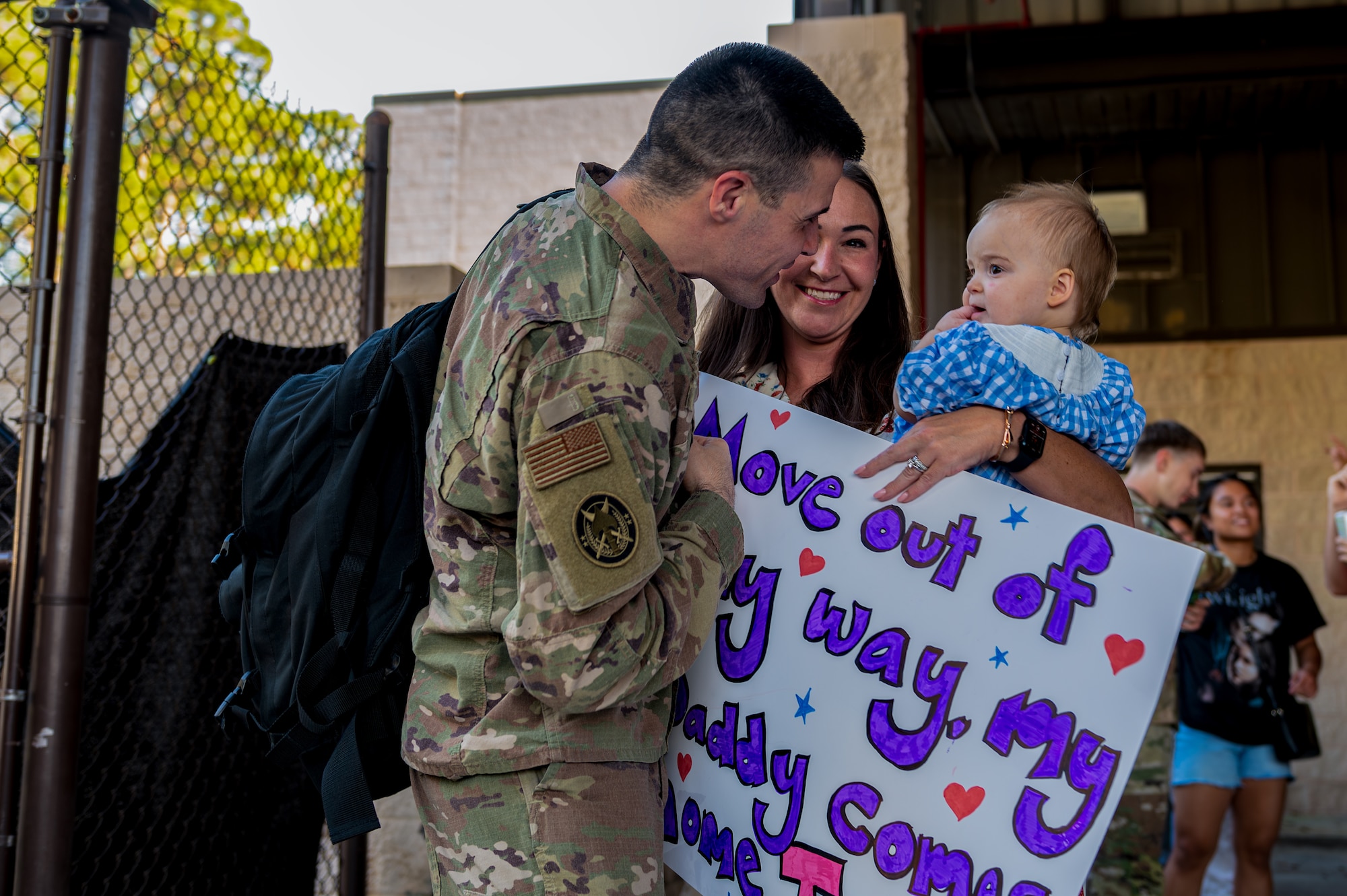 U.S. Air Force Master Sgt. Matthew Tarpley,  Air Force Special Operations Command A6 deployment manager, reunites with his family at Hurlburt Field, Florida, Oct. 7, 2024.