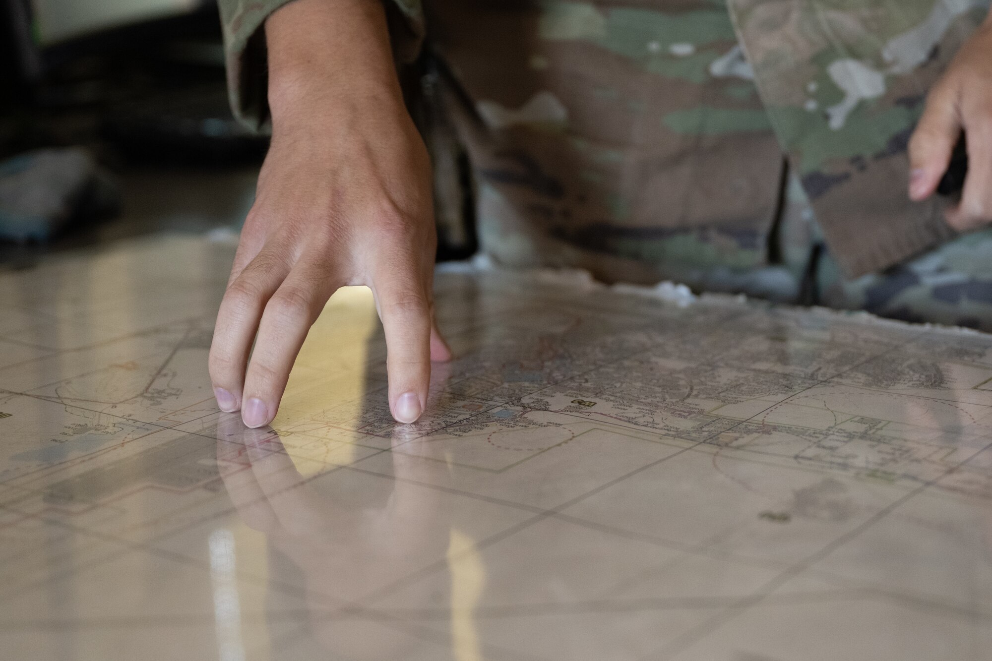 U.S. Air Force Staff Sgt. Garret Huffman, 1st Special Operations Security Forces Squadron Base Defense Operations Center controller, explains security procedures at Hurlburt Field, Florida, Sept. 30, 2024.