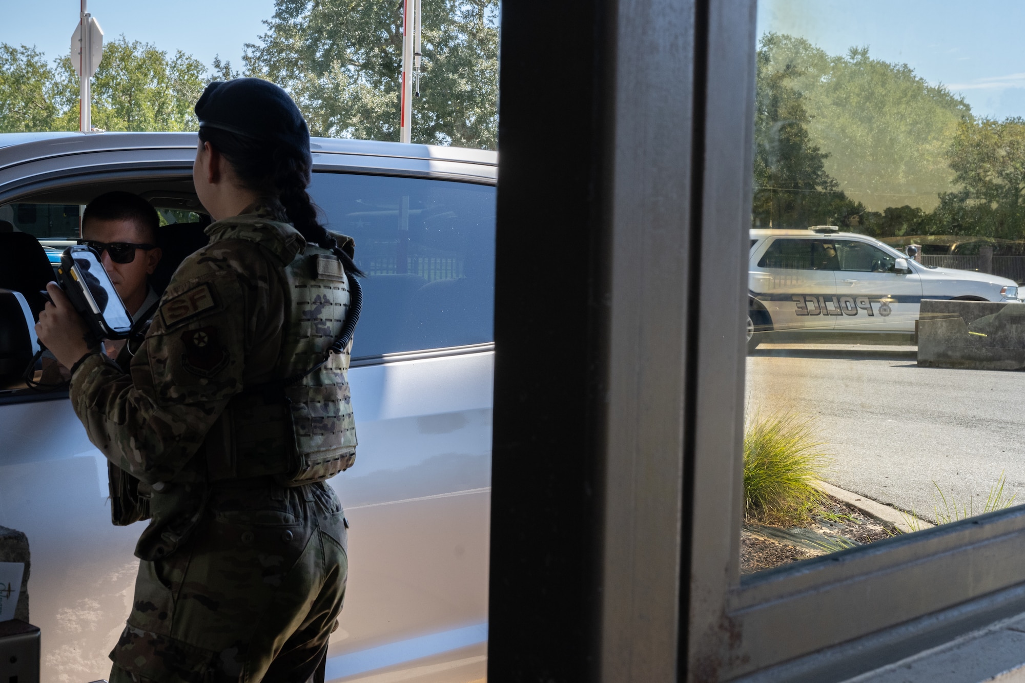 U.S. Air Force Airman 1st Class Lilia Perez, 1st Special Operations Security Forces Squadron patrolman, scans ID cards at Hurlburt Field, Florida, Sept. 30, 2024.