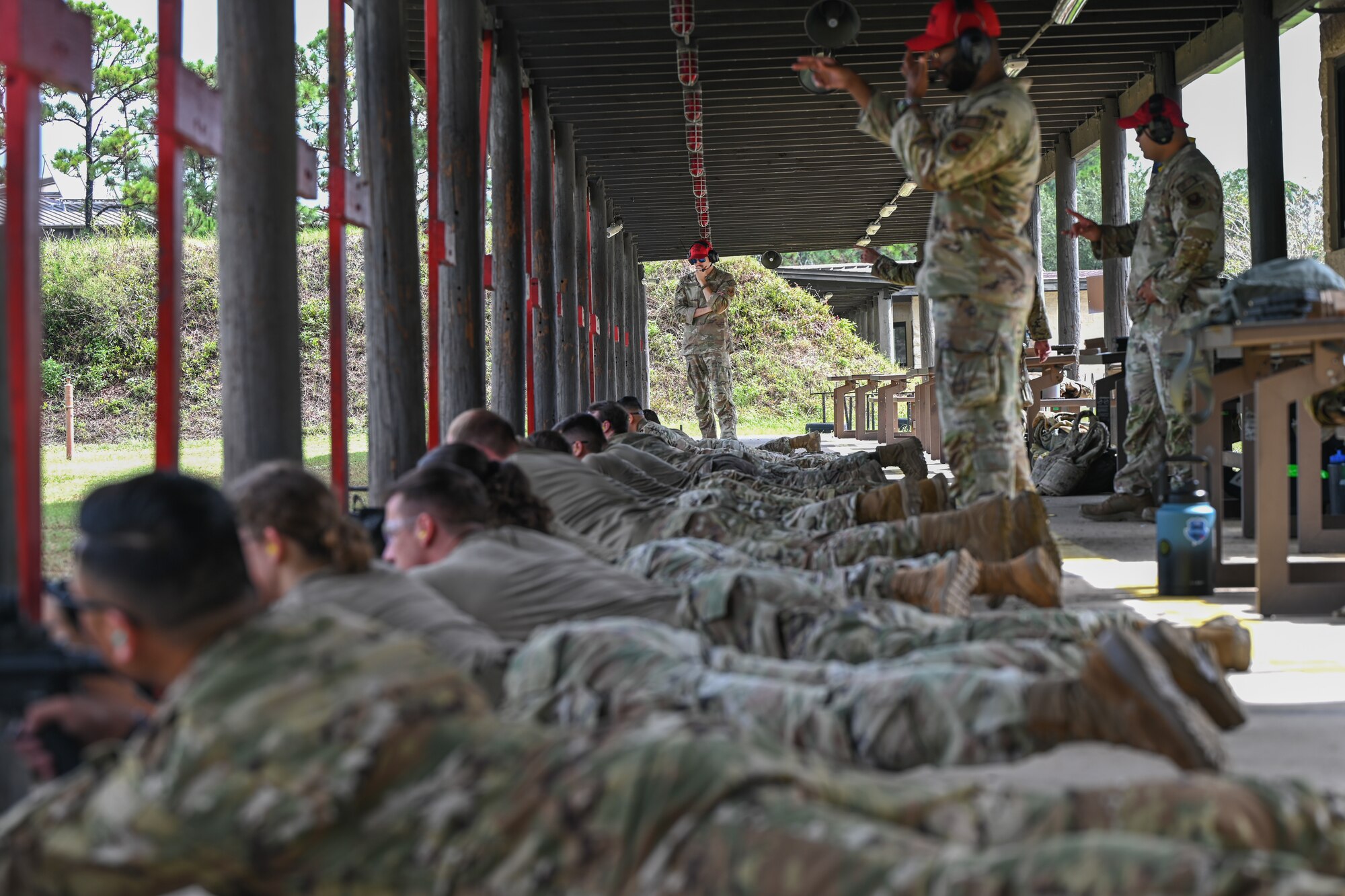 U.S. Airmen fire M4 rifles during the qualifying round  at the Combat Arms Training and Maintenance Range, Hurlburt Field, Florida, Sept. 25, 2024.