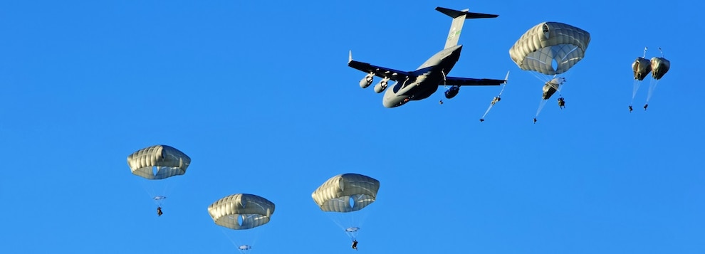 U.S. Army soldiers assigned to 2nd Infantry Brigade Combat Team (Airborne), 11th Airborne Division, descend from the sky onto Malamute Drop Zone on Joint Base Elmendorf-Richardson, Alaska for Arctic Aloha Oct. 15, 2024.