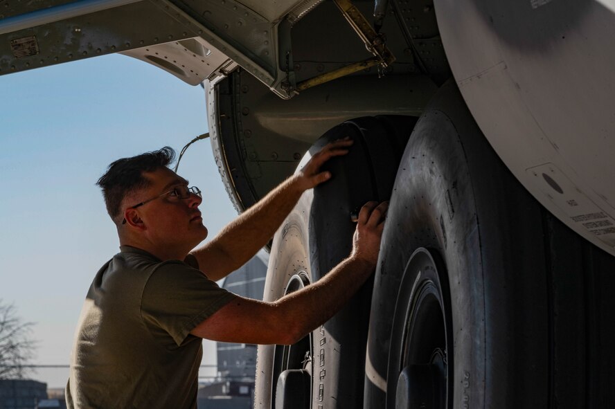 A U.S. Air Force crew chief, assigned to the 15th Special Operations Maintenance Squadron, conducts maintenance on an MC-130J Combat Talon II before take-off at Peterson Space Force Base, Colorado, Oct. 5, 2024.
