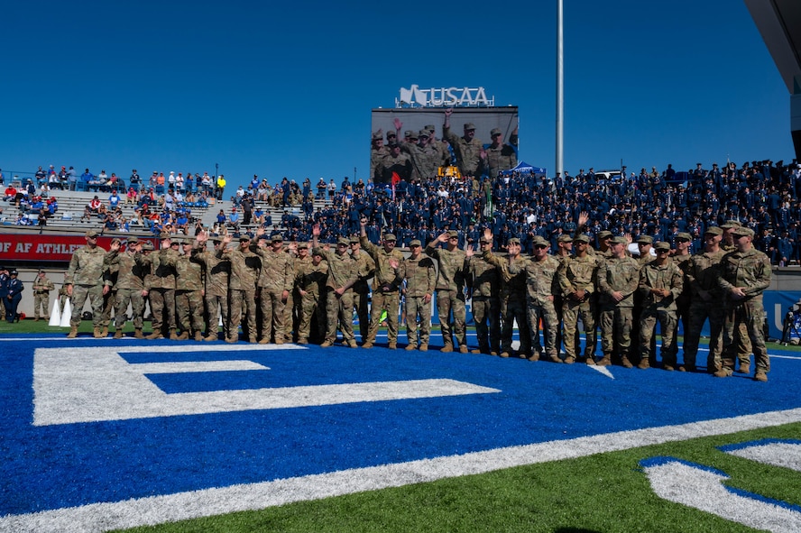 U.S. Airmen assigned to the 15th Special Operations Squadron, 4th Special Operations Squadron and 20th Special Operations Squadron, are recognized after a flyover at the United States Air Force Academy, Colorado, Oct. 5, 2024.