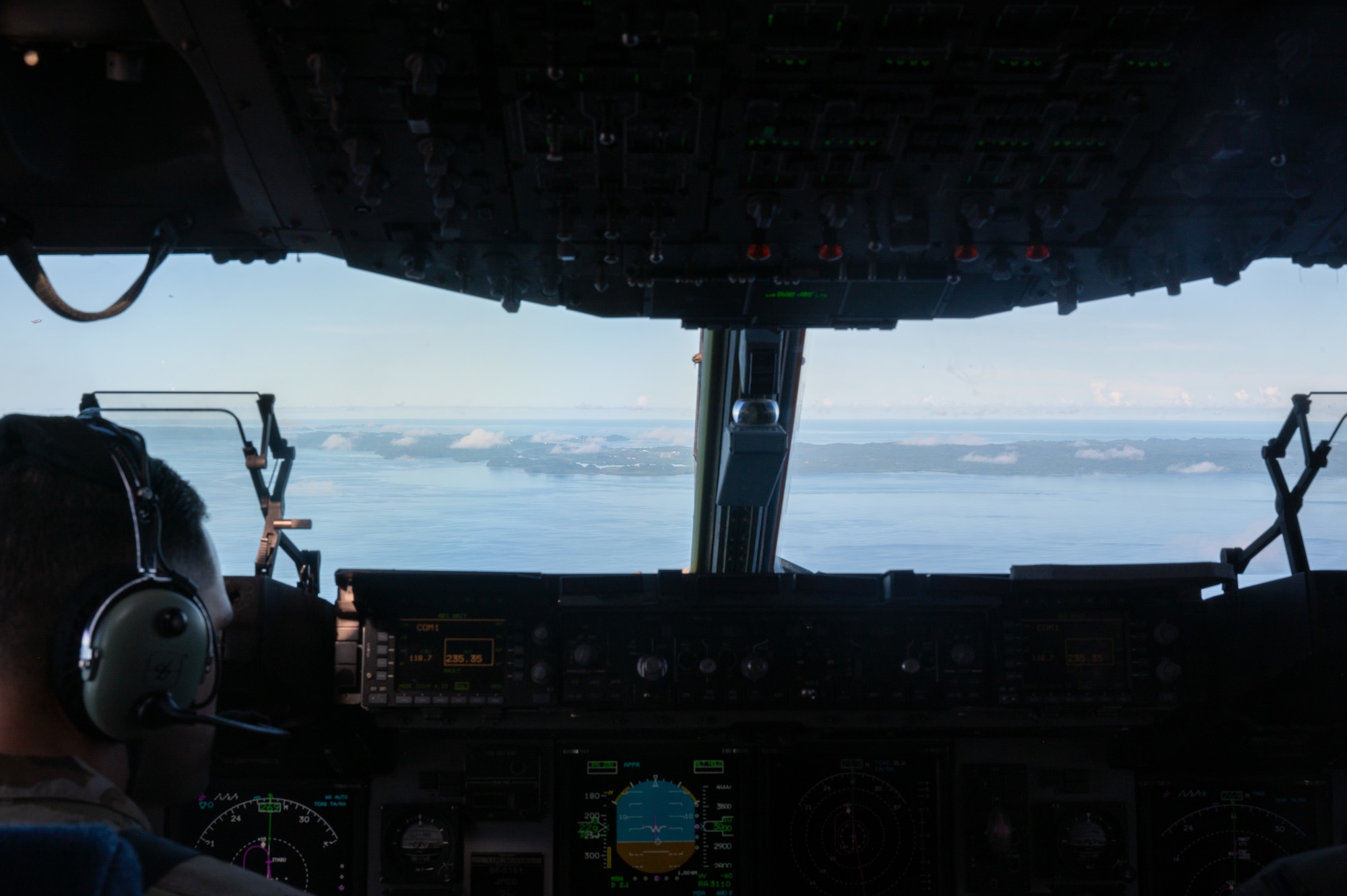 U.S. Air Force Maj. Justin Stanley, 535th Airlift Squadron pilot, approaches the nation of Palau during Joint Pacific Multinational Readiness Center 25-01 flying over the Pacific Ocean, Oct. 11, 2024. The Joint Pacific Multinational Readiness Center (JPMRC) is the Army’s newest Combat Training Center (CTC) and generates readiness in the environments and conditions where our forces are most likely to operate in. JPMRC 25-01 includes training participants from across the U.S. Joint Force, and multinational Allies and partners. (U.S Air Force photo by Senior Airman Mark Sulaica)