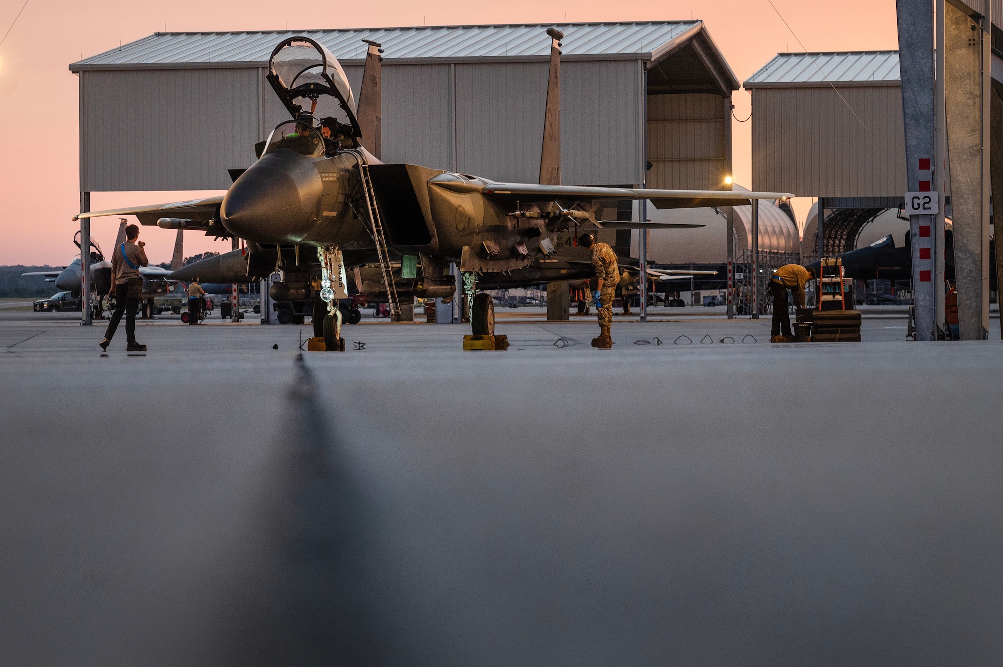 Airmen assigned to the 334th Fighter Generation Squadron perform pre-flight checks for an F-15E Strike Eagle