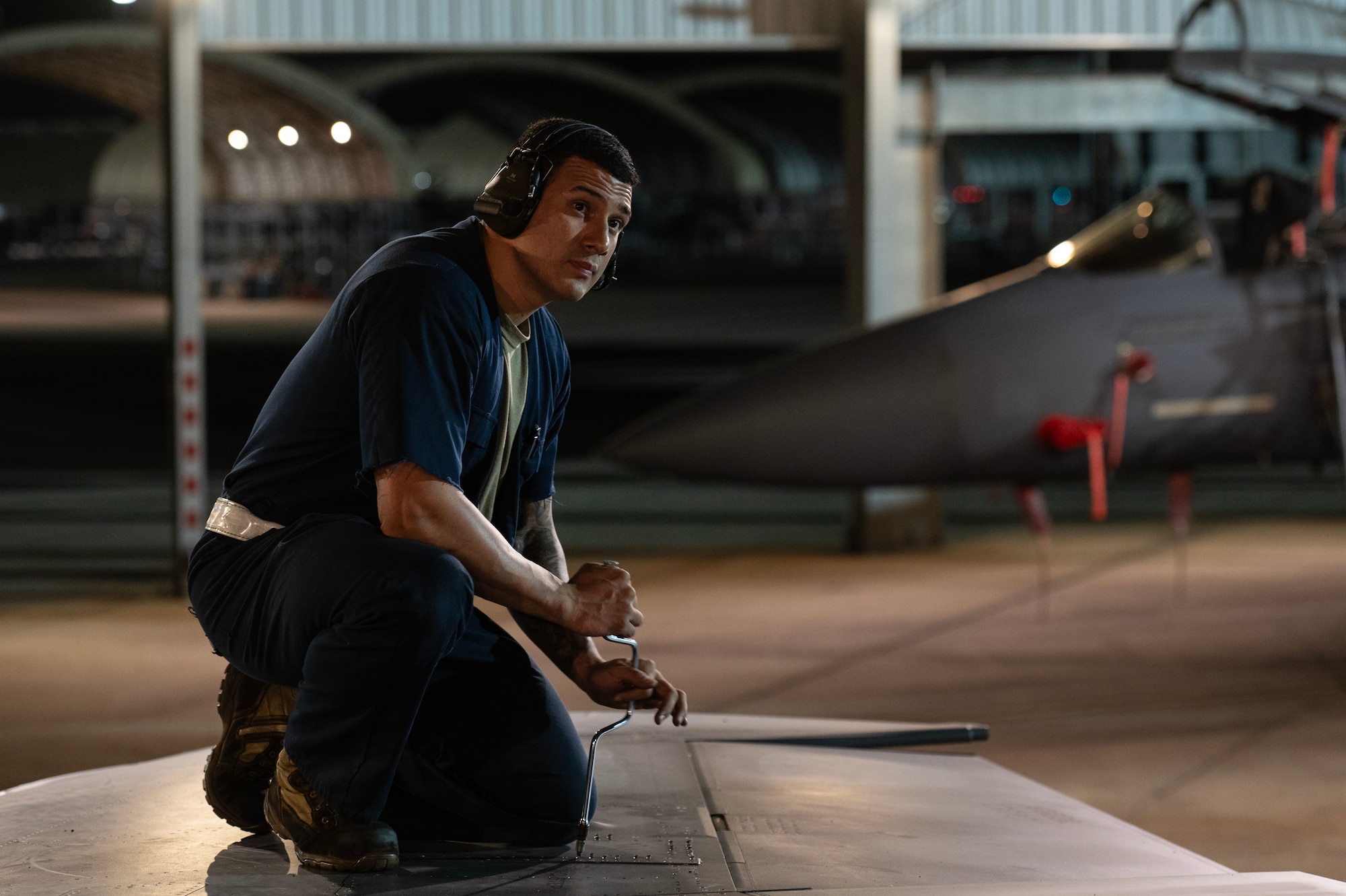 A U.S. Air Force Airman assigned to the 334th Fighter Generation Squadron performs maintenance on an F-15E Strike Eagle.