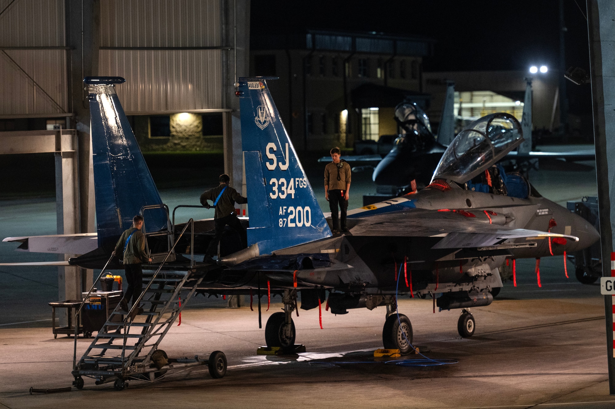 Airmen assigned to the 4th Fighter Wing perform maintenance on an F-15E Strike Eagle.