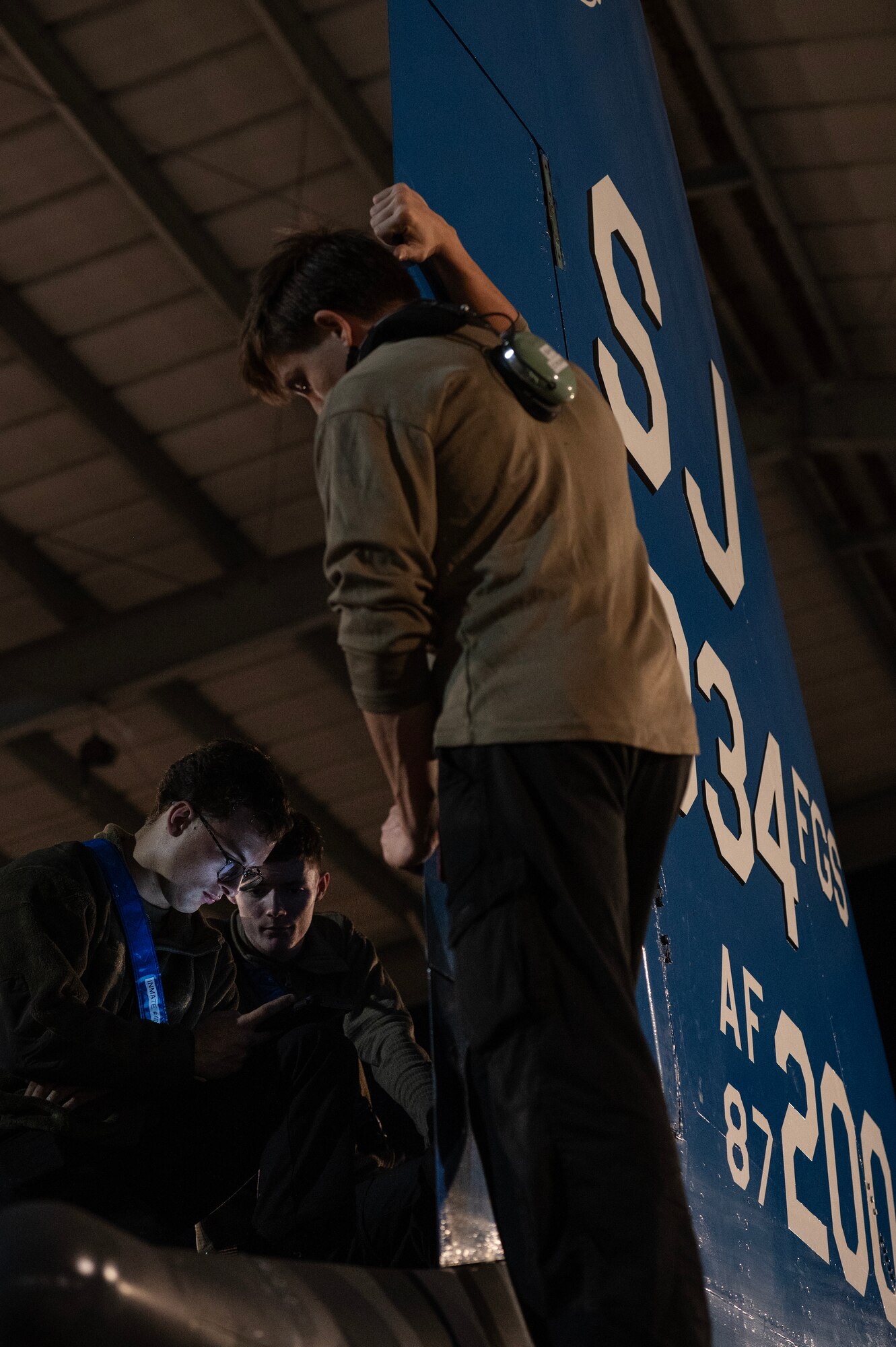 Airmen perform maintenance on an F-15E Strike Eagle.