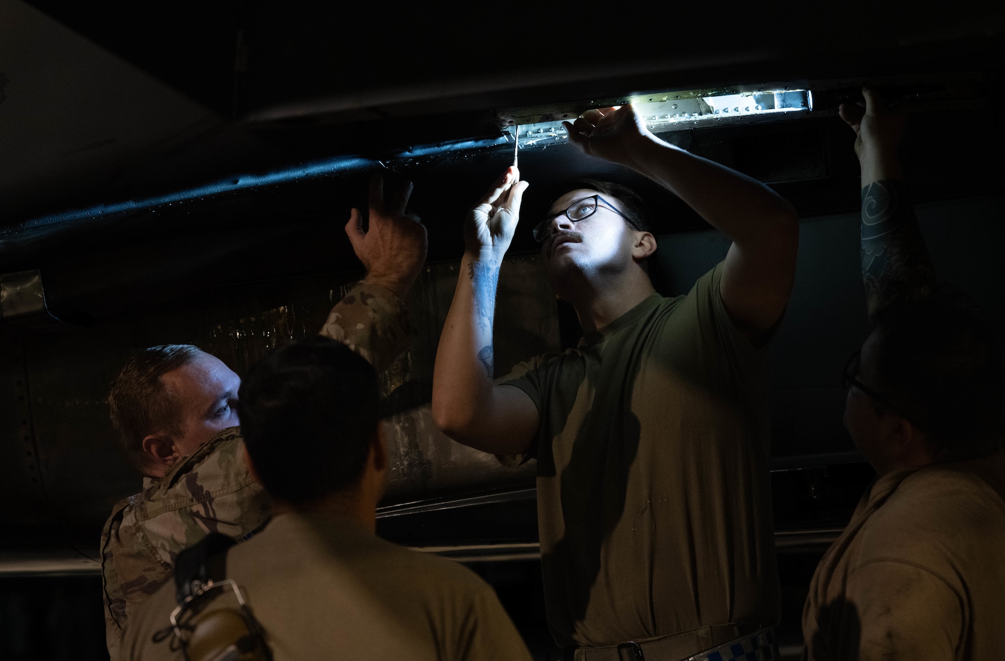 Airmen assigned to the 334th Fighter Generation Squadron perform maintenance on an F-15E Strike Eagle.