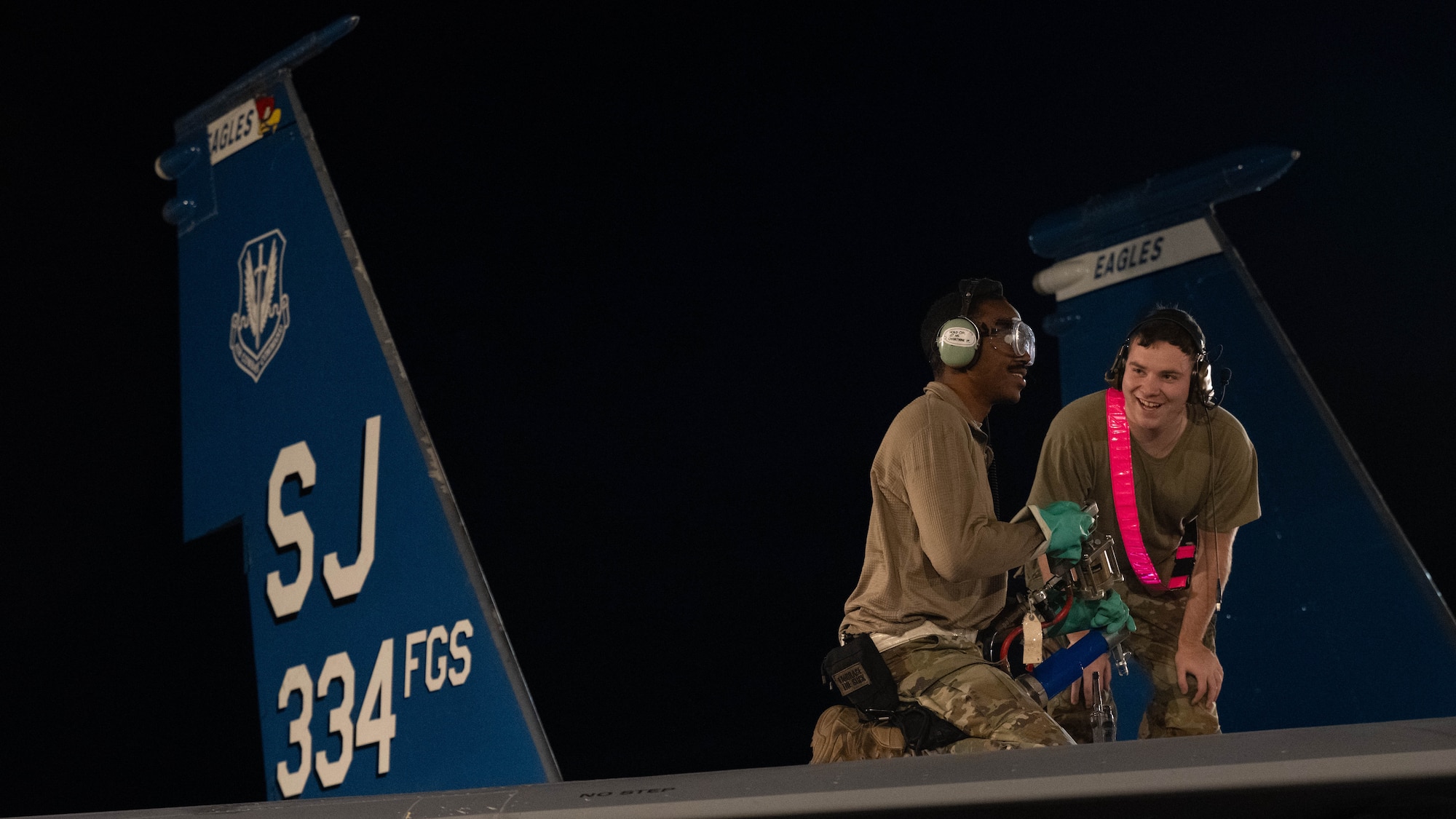 Airmen assigned to the 4th Component Maintenance Squadron perform maintenance on an F-15E Strike Eagle.