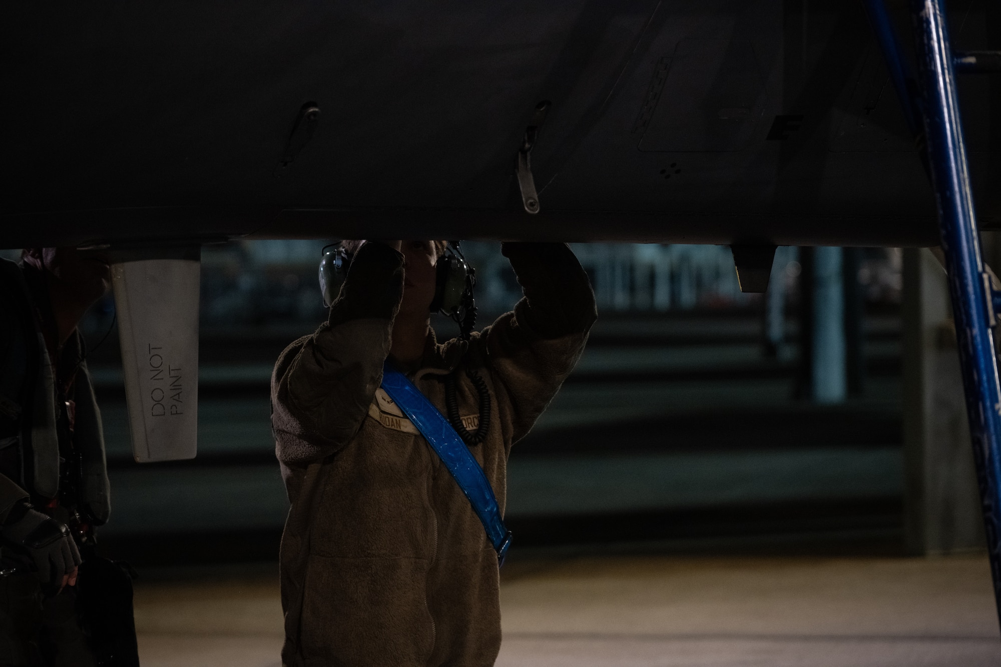 A1C Rudan, 334th Fighter Generation Squadron, performs maintenance on an F-15E Strike Eagle during a “Super Nights” training event.