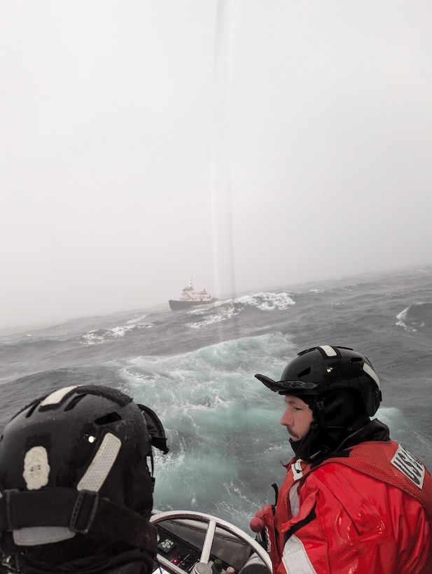 Coast Guard boat crew arrives at search and rescue scene