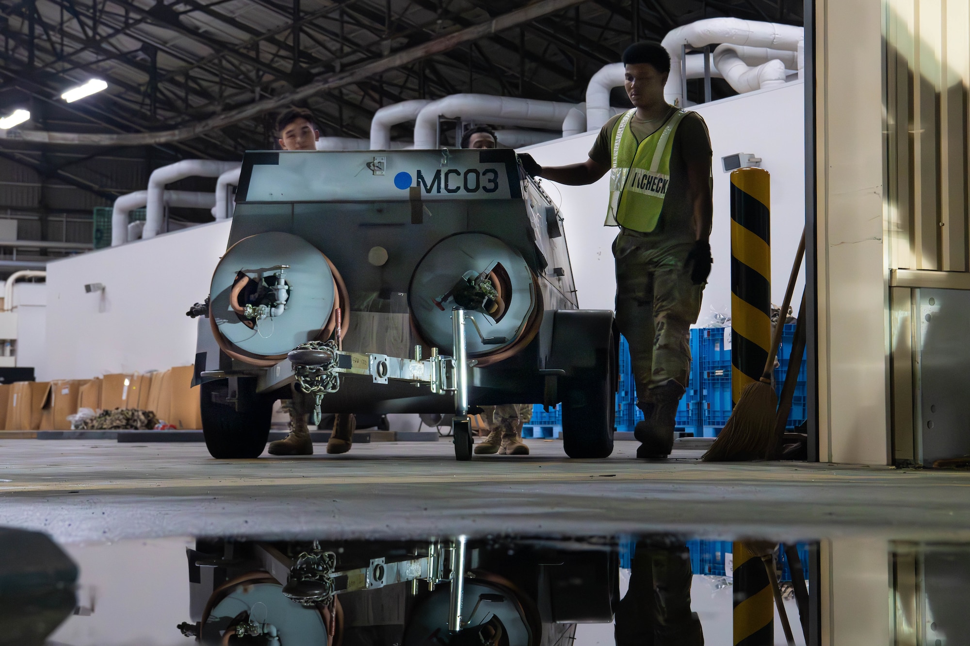 U.S. Air Force Airmen assigned to the 374th Logistics Readiness Squadron move cargo.