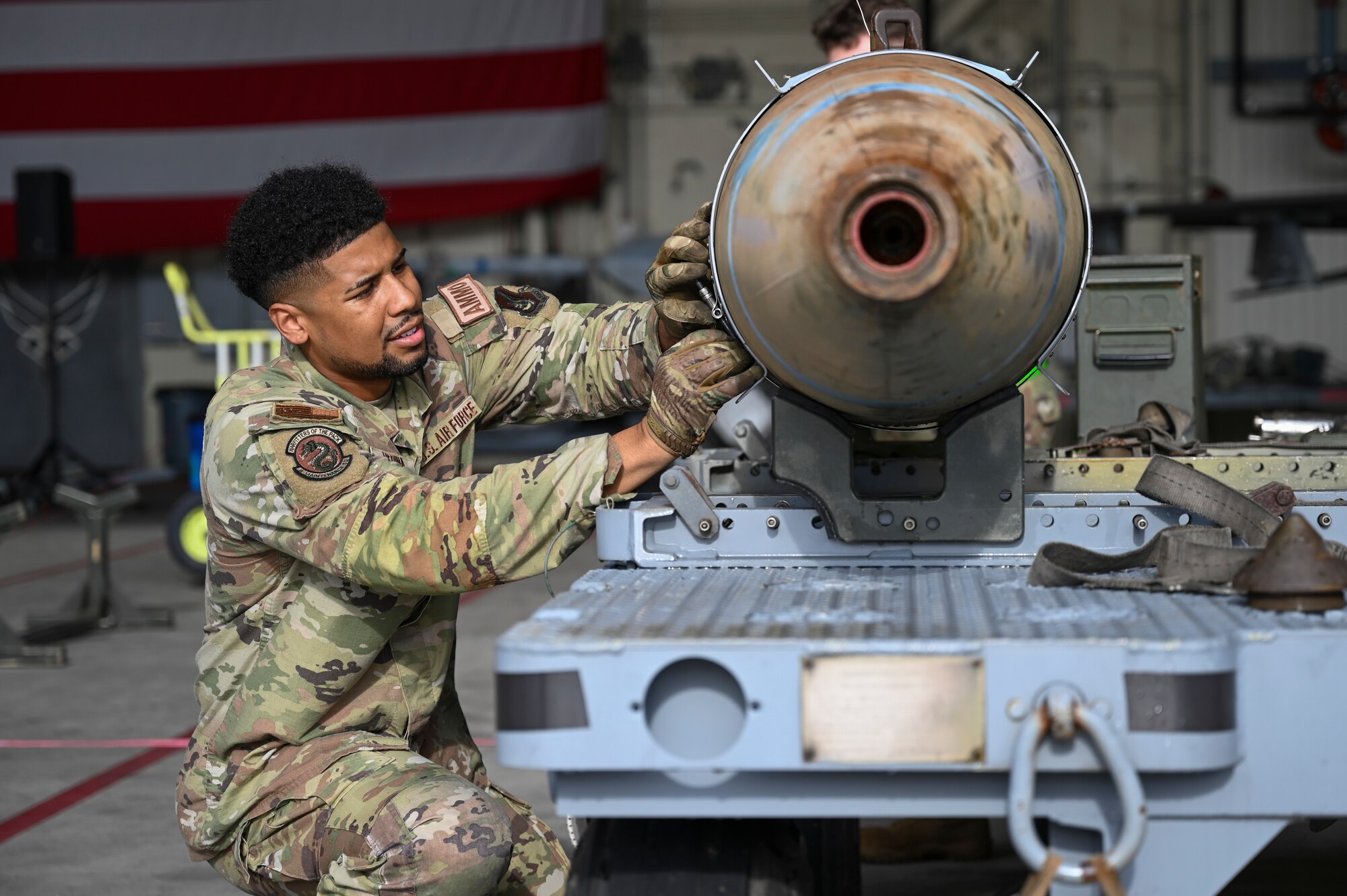U.S. Air Force Staff Sgt. Hector Medina, 8th Maintenance Squadron combat plans supervisor, assembles a munition for loading during the 2024 3rd Quarter Dedicated Crew Chief and Load Crew Competition.
