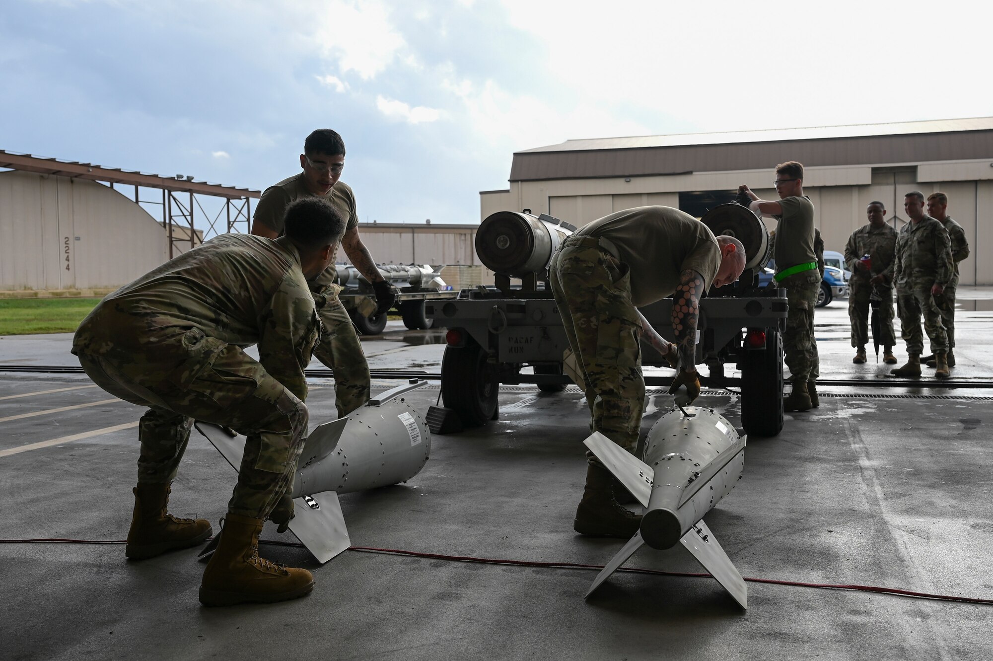 Airmen assigned to the 8th Maintenance Squadron, prepare munitions for loading during the 2024 3rd Quarter Dedicated Crew Chief and Load Crew Competition.