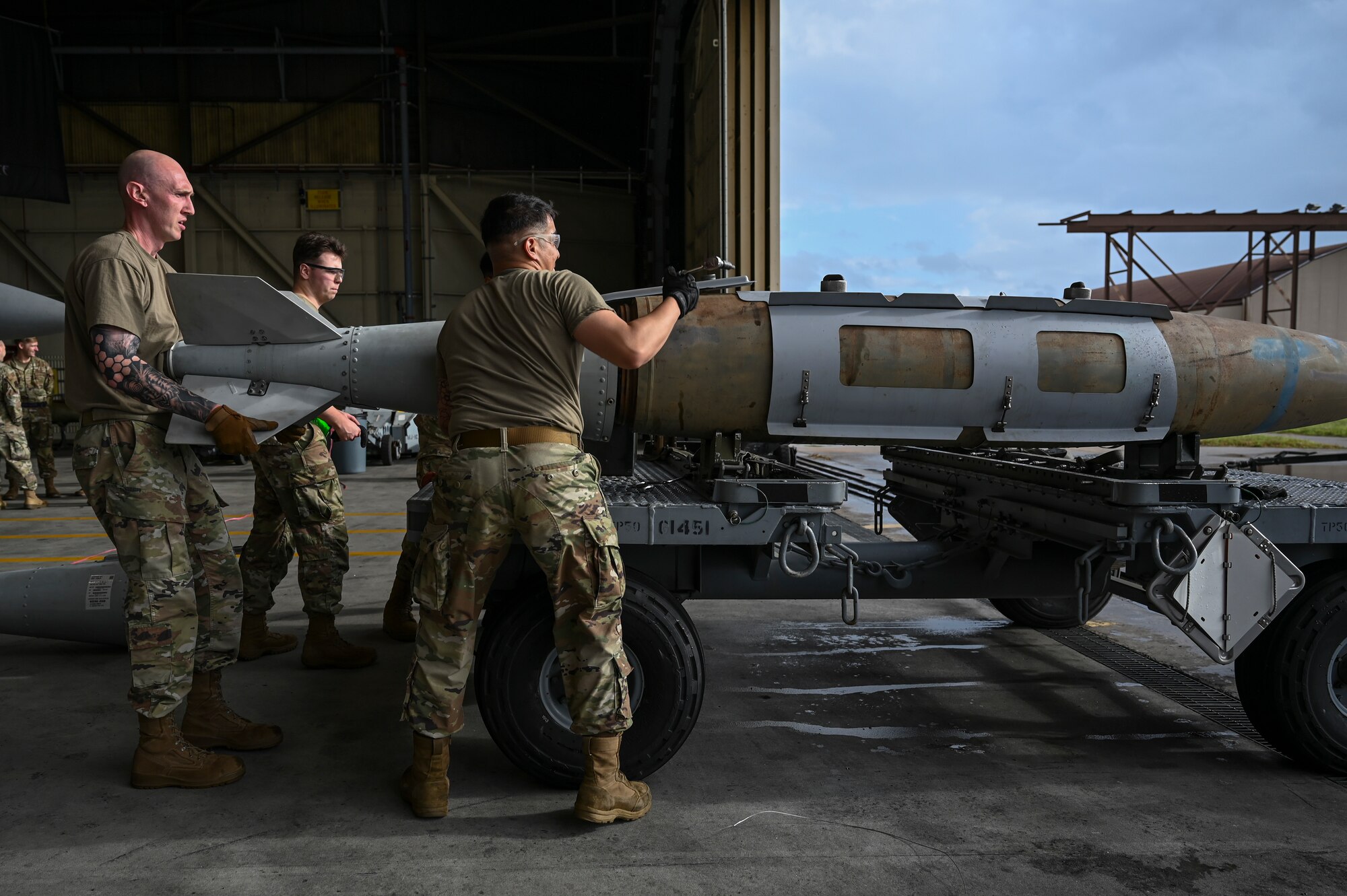 Airmen assigned to the 8th Maintenance Squadron, prepare munitions for loading during the 2024 3rd Quarter Dedicated Crew Chief and Load Crew Competition.