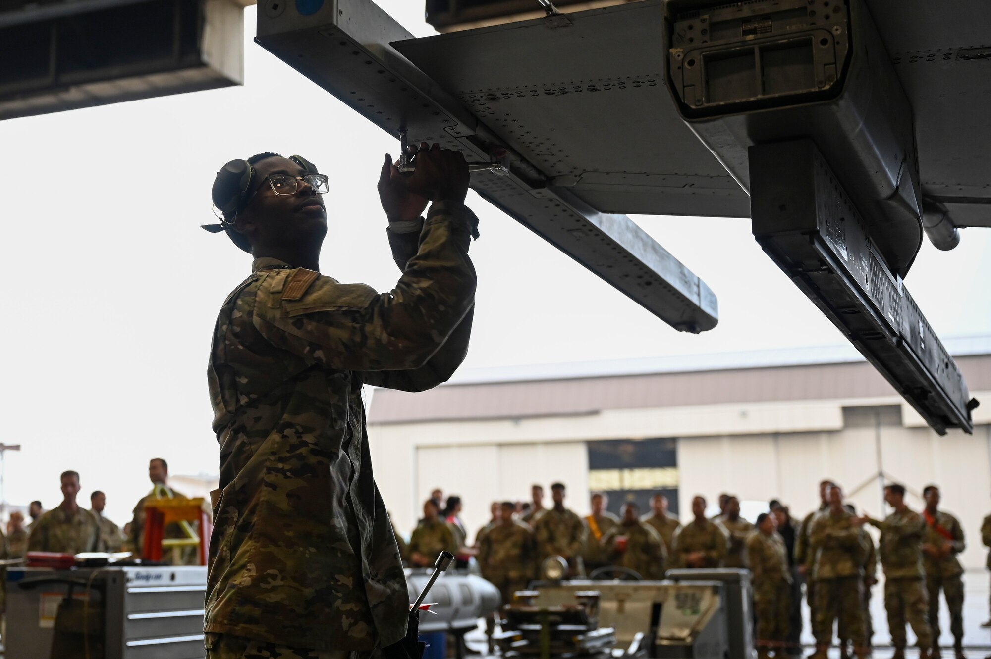 Airman Marquis Mason, 35th Fighter Generation Squadron weapons load crew, prepares an F-16 Fighting Falcon aircraft weapons station during the 2024 3rd Quarter Dedicated Crew Chief and Load Crew Competition.