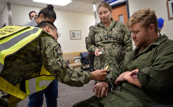 Navy Medicine Readiness Training Unit Bangor staff rapidly responded to a [mock] earthquake, Oct. 17, 2024. The exercise scenario – held in conjunction with Commander Naval Installations Command Citadel Rumble and Operation Dynamo 2024 – provided the opportunity for the branch health clinic to test a handful of objectives which are considered crucial during any actual seismic event. Clinic personnel were able to effectively test their collective capability to drop, cover and hold; evacuated all personnel, achieve 100 percent accountability of all those evacuated; provide triage to injured appropriately, and readily exchange timely communication with each other throughout the drill (Official Navy photo by Douglas H Stutz, NHB/NMRTC Bremerton public affairs officer).