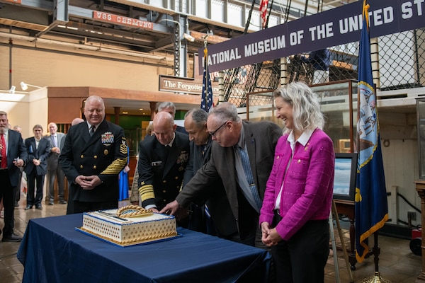 Adm. James Kilby, Vice Chief of Naval Operations, Secretary of the Navy Carlos Del Toro, and Naval History and Heritage Command Director Samuel J. Cox, a retired U.S. Navy rear admiral, cut a cake in honor of the Navy's 249th birthday, Oct. 18, 2024, at the National Museum of the United States Navy.