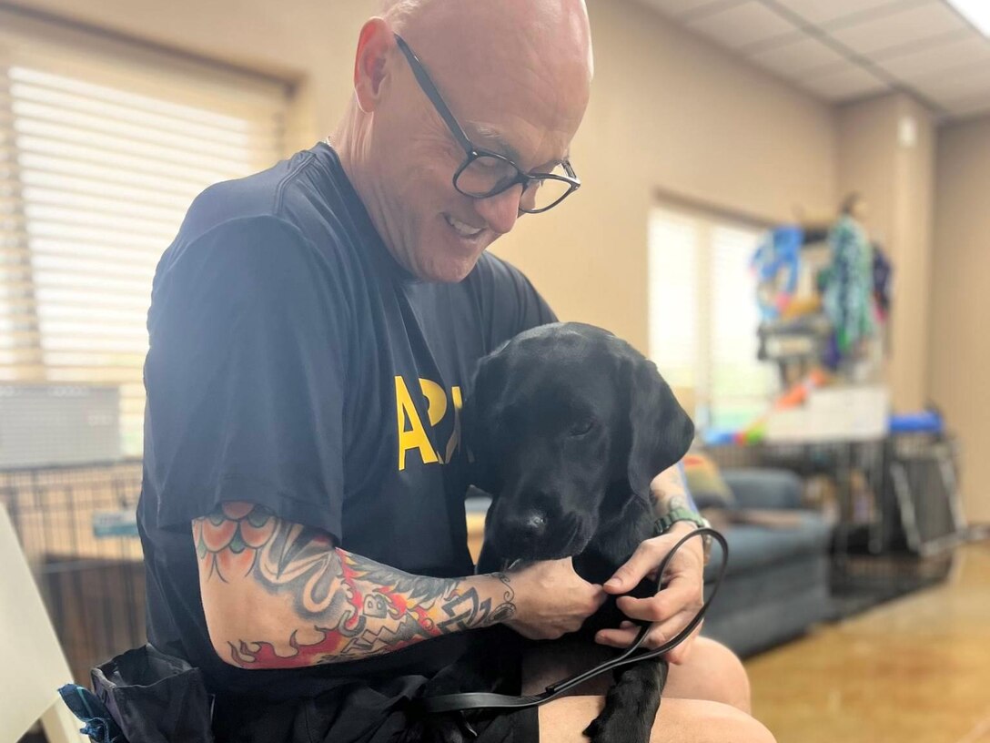 Maj. Ken LeBlanc working in canine therapy.