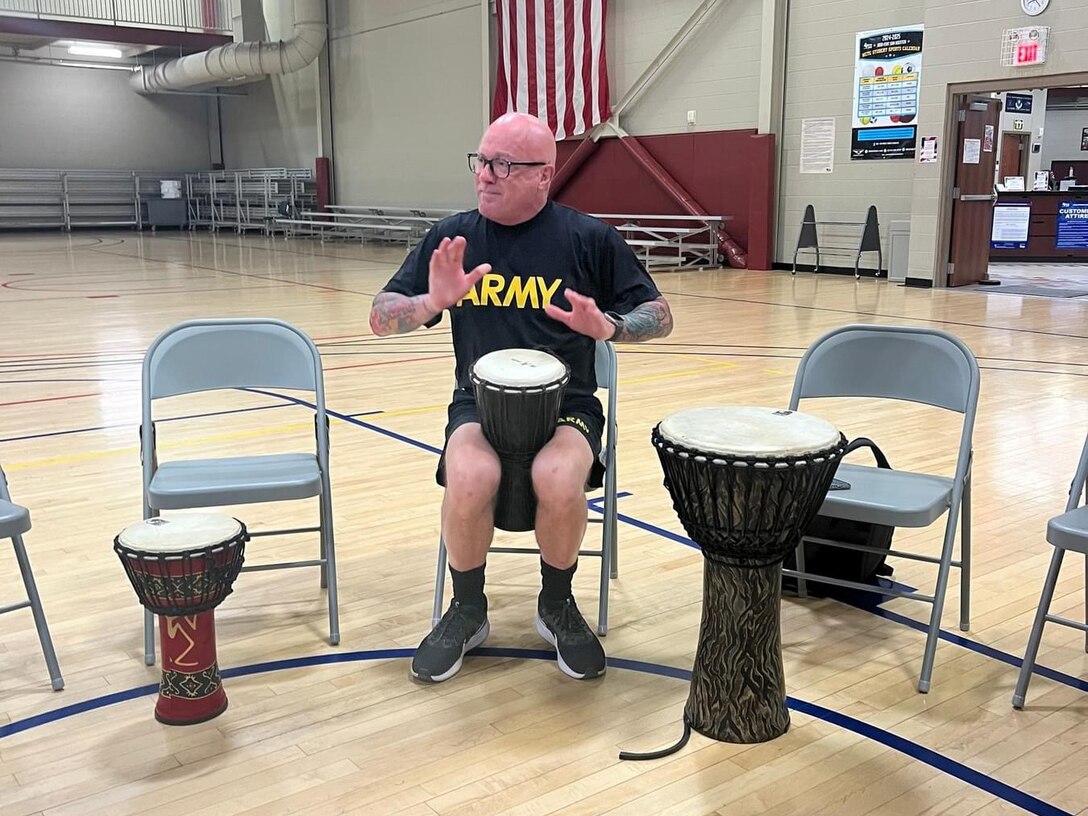 Maj. Ken LeBlanc particpating in drum therapy.