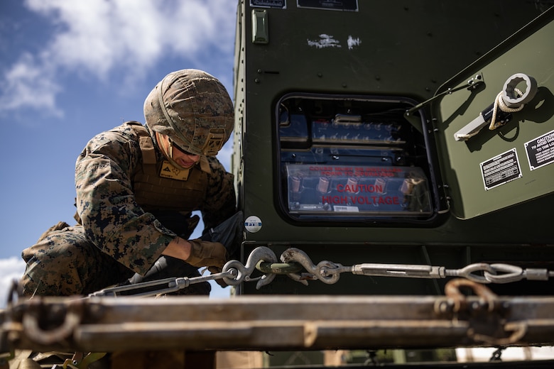 U.S. Marine Corps Lance Cpl. Ethan Richter, a field artillery radar operator with 12th Marine Littoral Regiment, 3d Marine Division connects an AN/TPS-80 Ground/Air Task Oriented Radar cable to a power generator during exercise Resolute Dragon 24 at Japan Ground Self-Defense Force Camp Yonaguni, Okinawa, Japan, July 31, 2024. The radar was deployed to support training with enhanced sensing and targeting data between 12th MLR and the JSDF during RD 24. This effort aims to enhance operational readiness in the region, underscoring the U.S. Marine Corps’ commitment to maintaining peace and security in the Indo-Pacific through realistic training with innovative and proven technology. RD 24 is an annual bilateral exercise in Japan that strengthens the command, control, and multi-domain maneuver capabilities of U.S. Marines in the III Marine Expeditionary Force and Japan Self-Defense Force personnel, with a focus on controlling and defending key maritime terrain.