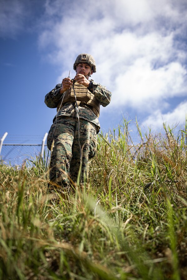 U.S. Marine Corps Lance Cpl. Saul Guerreroramos, an aviation radar technician with Marine Air Control Squadron 4, Marine Air Control Group 18, 1st Marine Air Wing connects an AN/TPS-80 Ground/Air Task Oriented Radar ground wire during exercise Resolute Dragon 24 at Japan Ground Self-Defense Force Camp Yonaguni, Okinawa, Japan, July 31, 2024. The radar was deployed to support training with enhanced sensing and targeting data between 12th MLR and the JSDF during RD 24. This effort aims to enhance operational readiness in the region, underscoring the U.S. Marine Corps’ commitment to maintaining peace and security in the Indo-Pacific through realistic training with innovative and proven technology. RD 24 is an annual bilateral exercise in Japan that strengthens the command, control, and multi-domain maneuver capabilities of U.S. Marines in the III Marine Expeditionary Force and Japan Self-Defense Force personnel, with a focus on controlling and defending key maritime terrain.